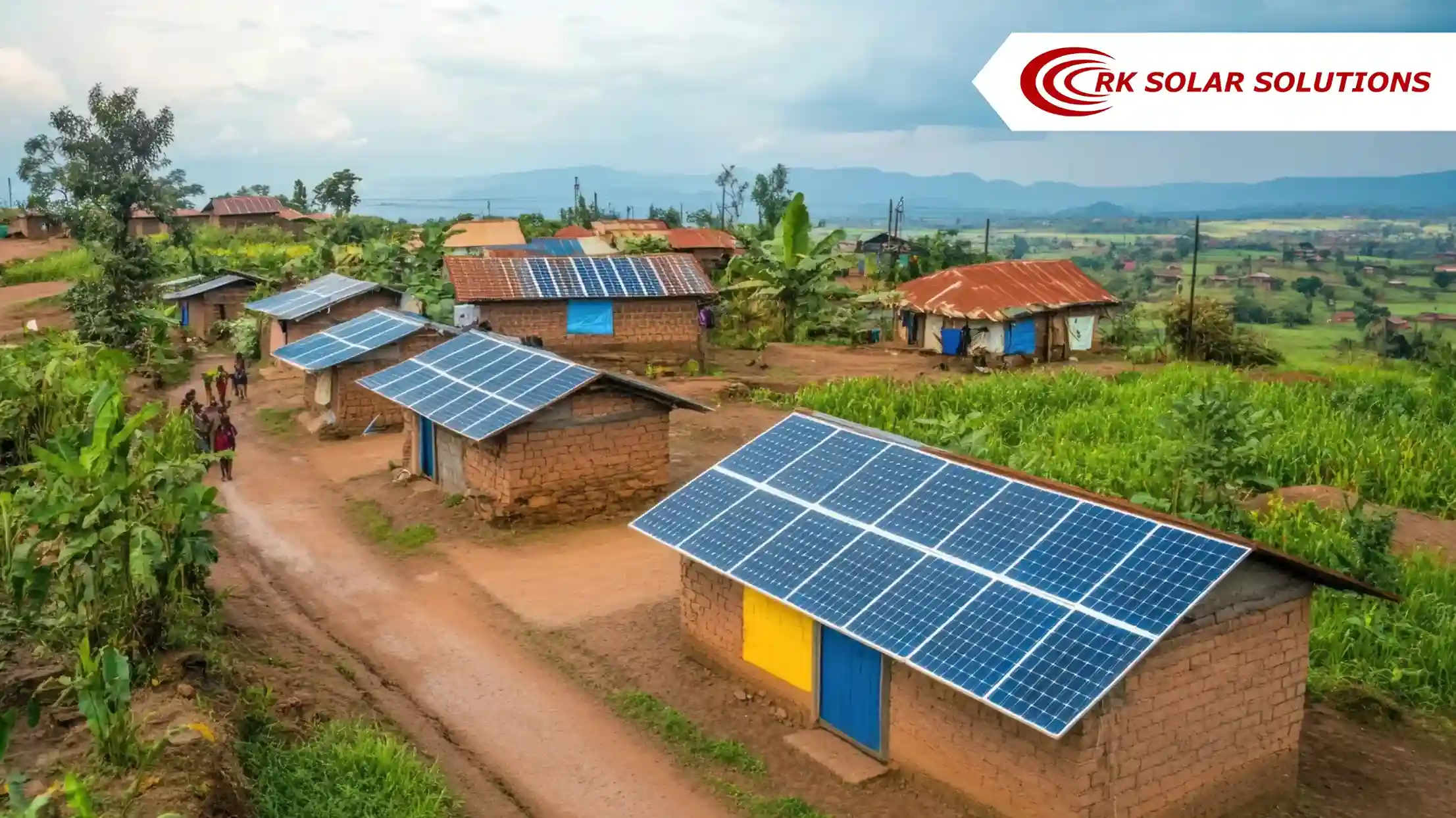Village houses with solar panels on their roofs beside a dirt road